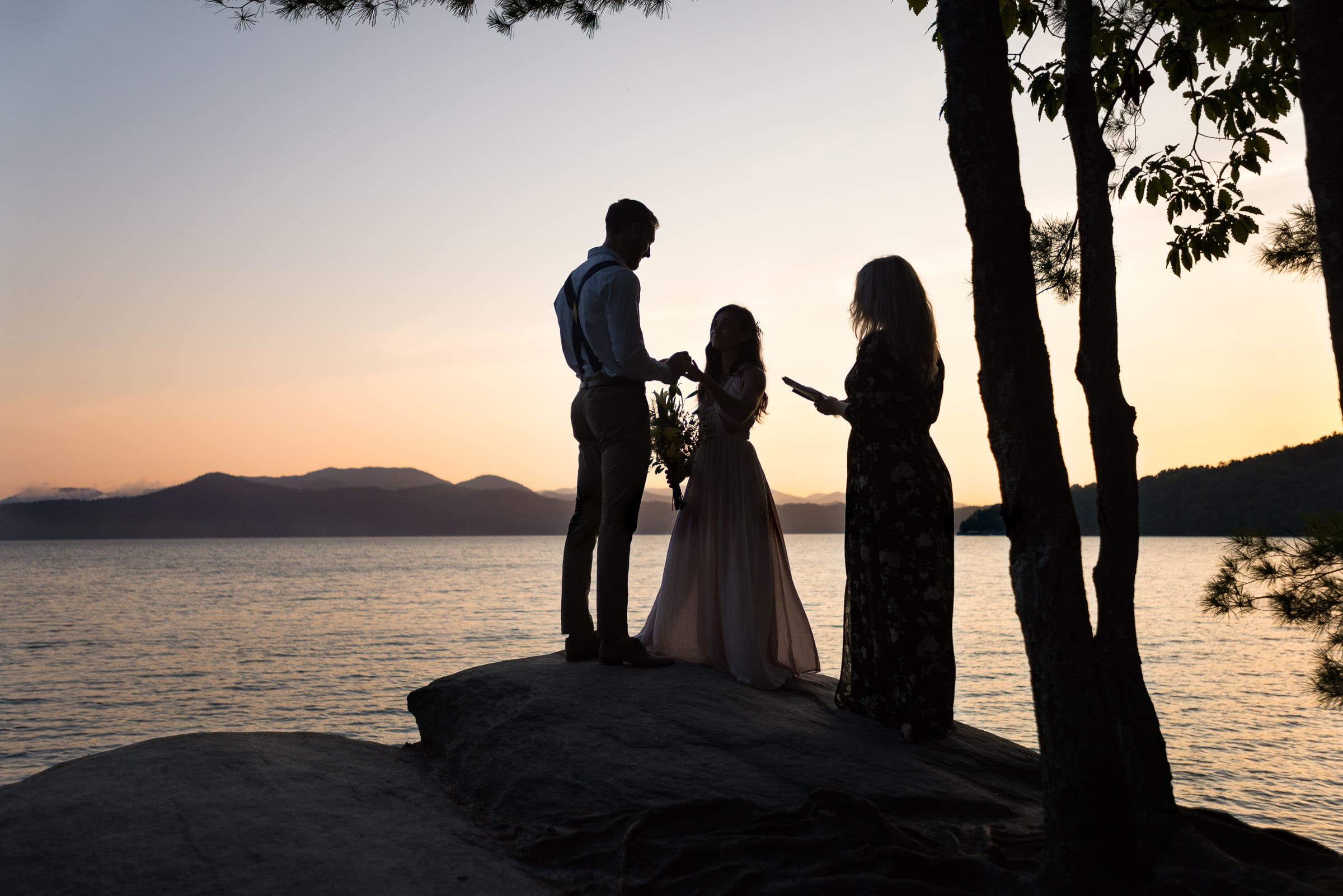 Elopement ceremony overlooking a lake in South CArolina at dawn captured by an adventure wedding and elopement photographer