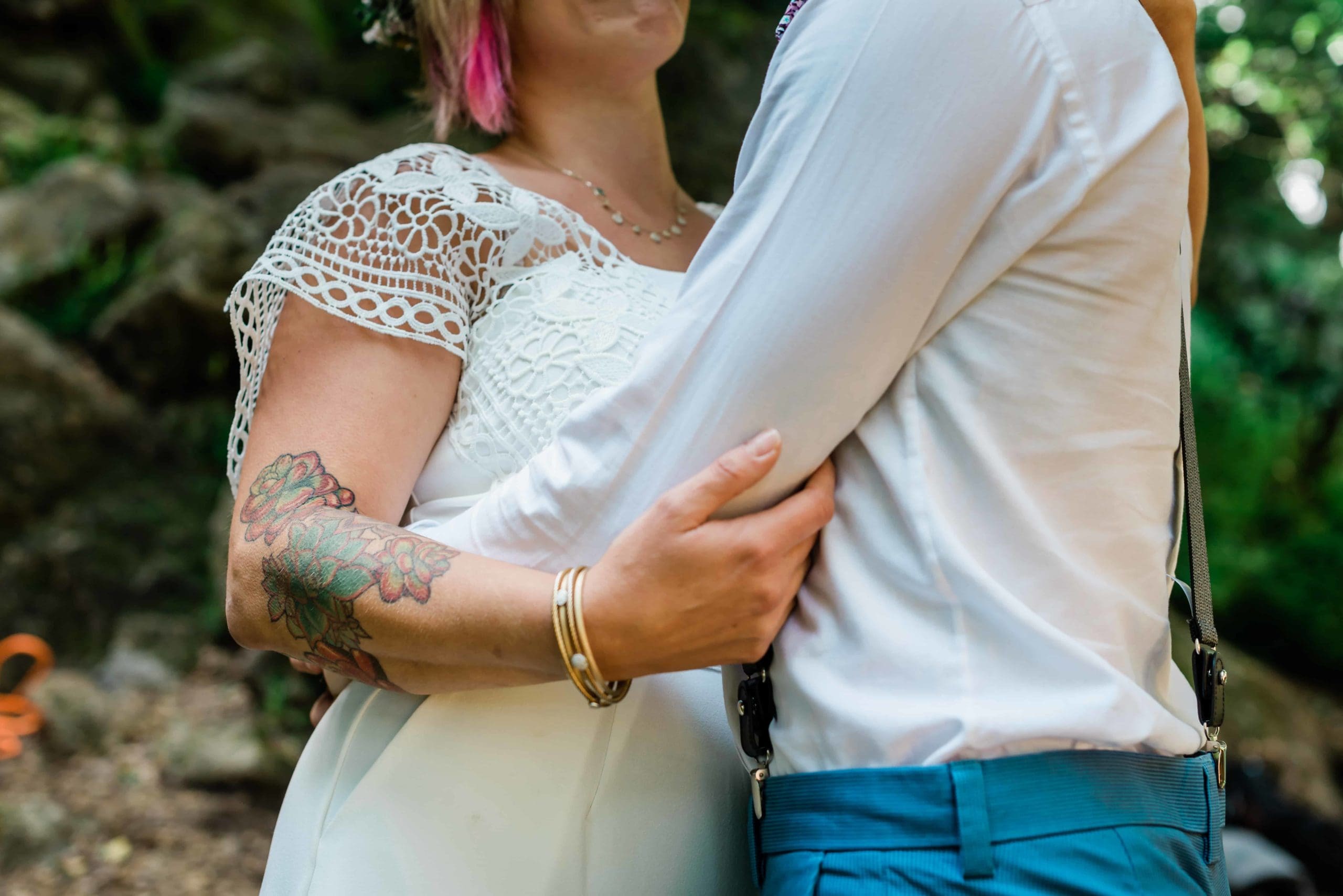 Couple embraces at their adventurous rock climbing elopement.