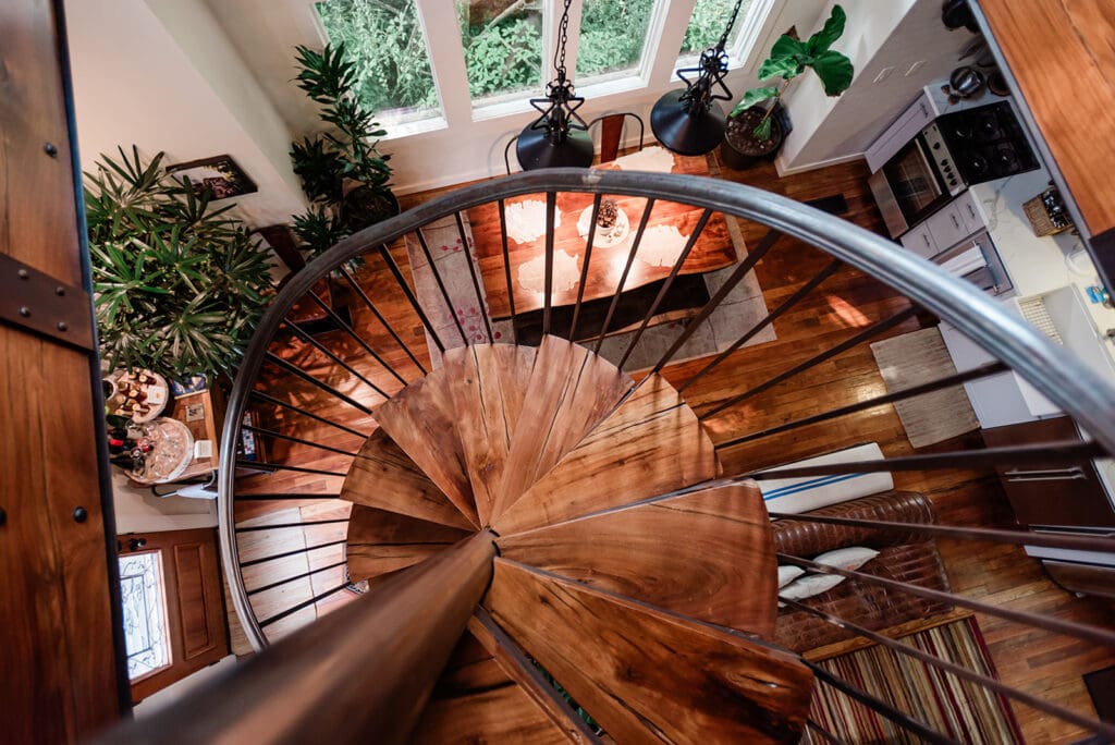 This is a picture of a spiral staircase inside a treehouse.