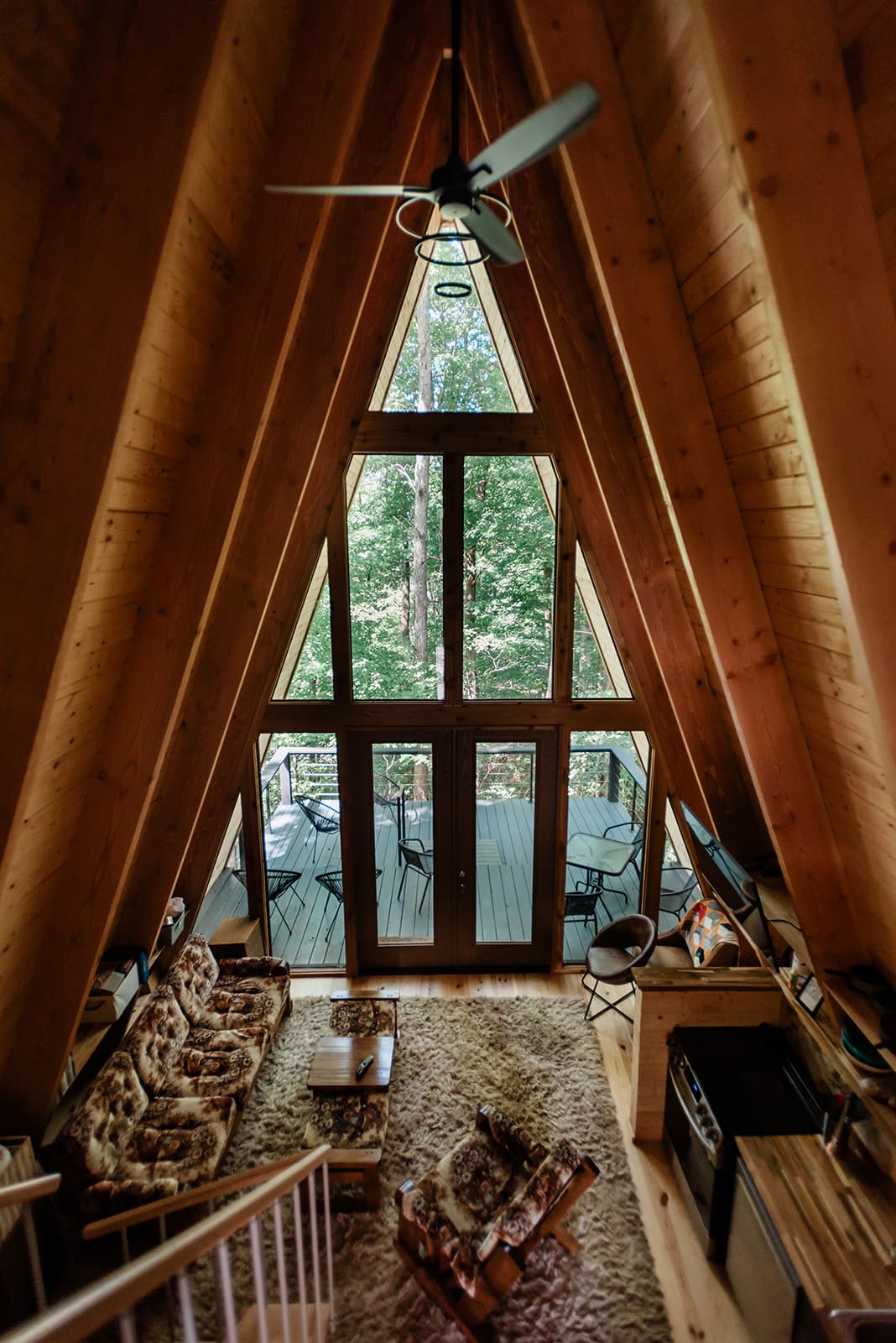 This is a picture of a treehouse wedding venue that is an a-frame cabin.