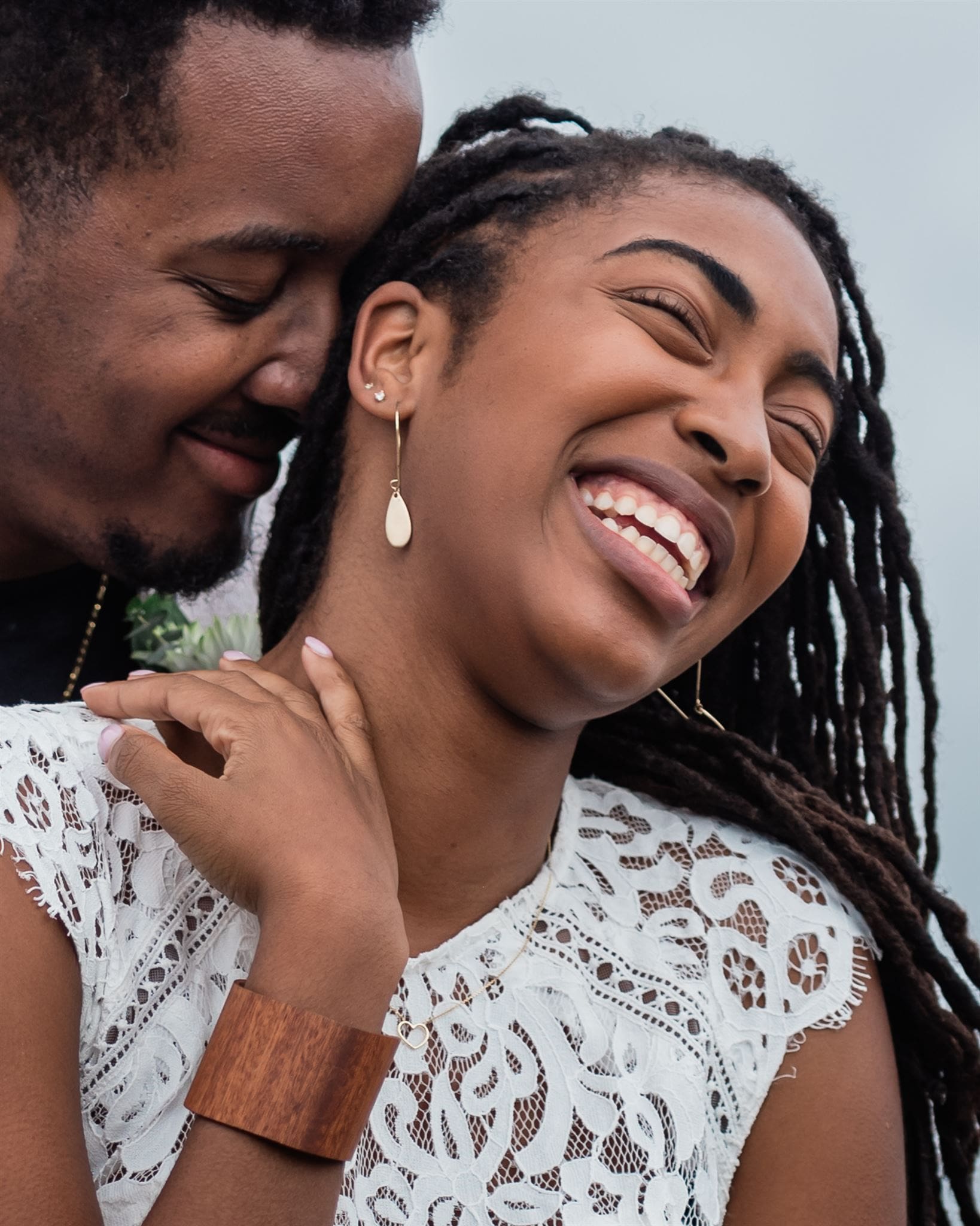 This is a picture of a bride and groom smiling close with each other during their adventure elopement.