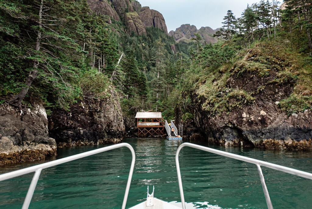 This is a picture of a boat carrying a bride and groom to their lodging only reachable by boat.